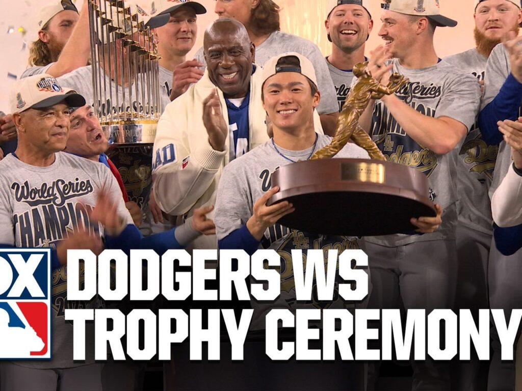 Yoshinobu Yamamoto holds the MVP award during the 2025 MLB World Series trophy presentation.